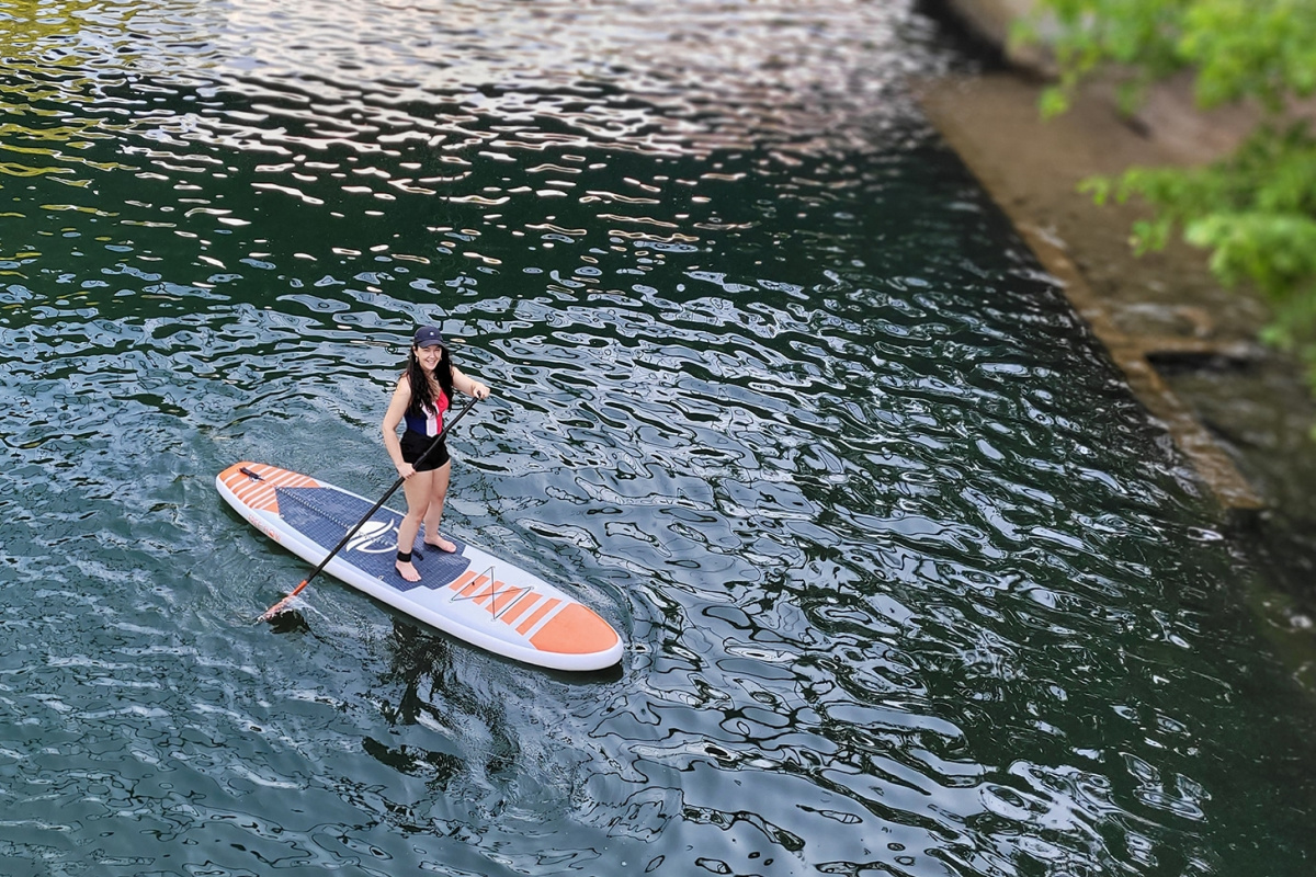 Woman on paddle board in lake