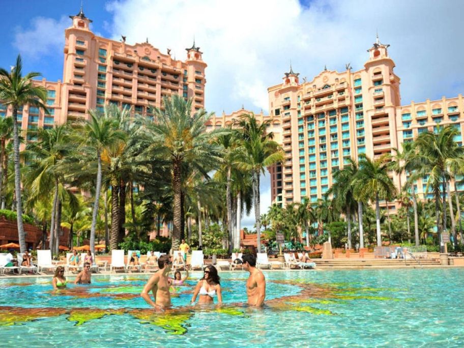 Atlantis hotel with people in the water in front of it