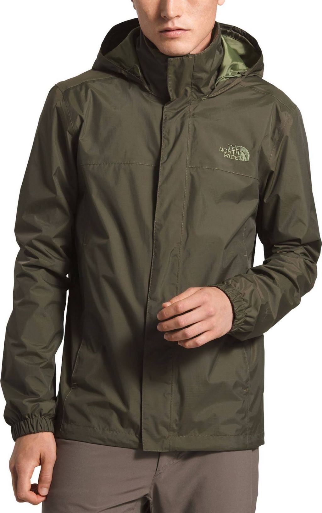 stock photo of man wearing green the north face jacket
