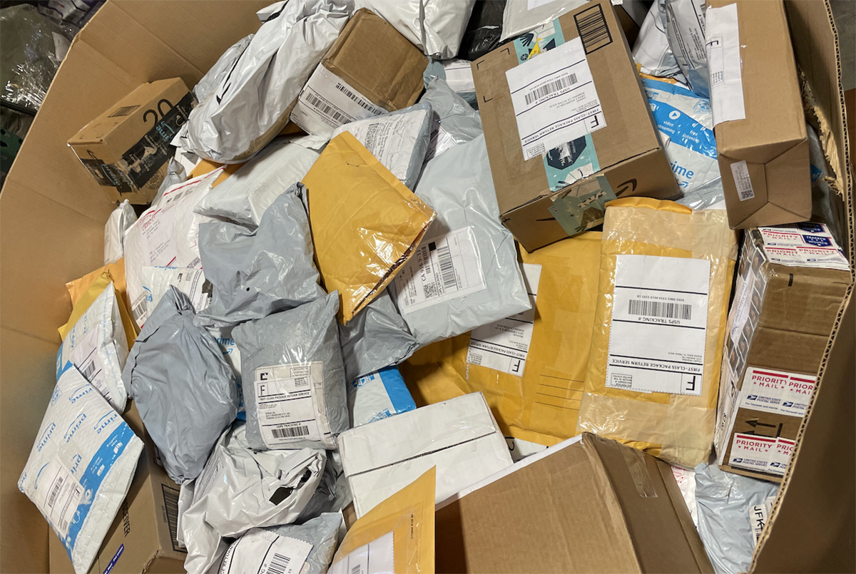 unclaimed mail in bin - shipping services