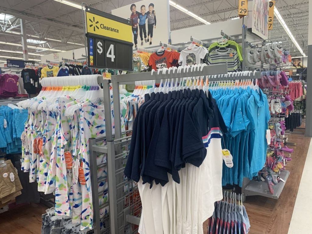 shirts on hangers in a Walmart store