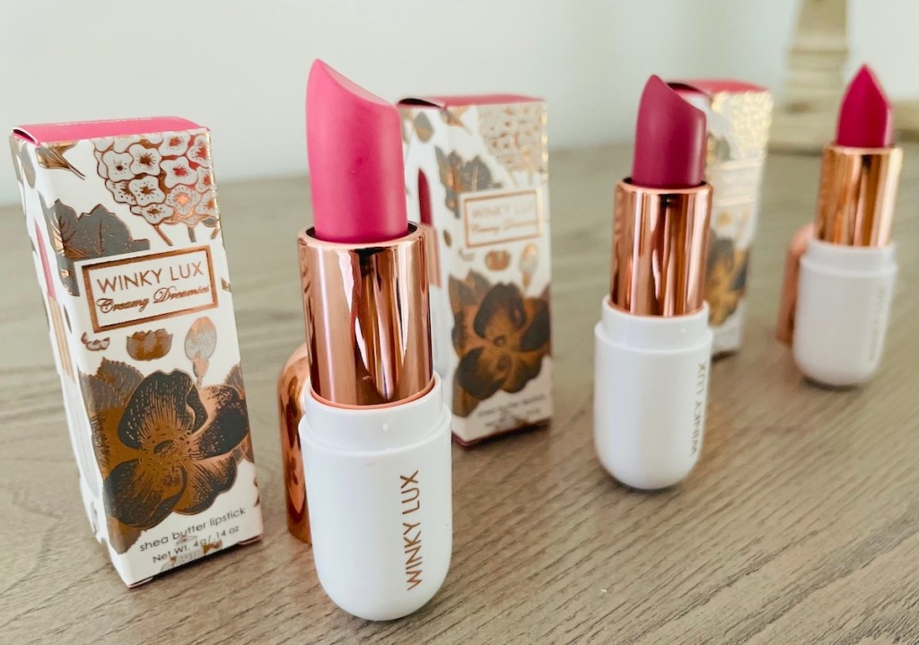 row of winky lux lipsticks with packaging 