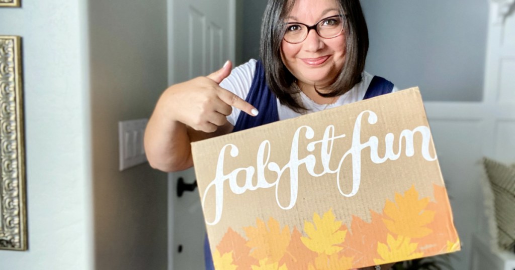 woman pointing to fall fab fit fun box
