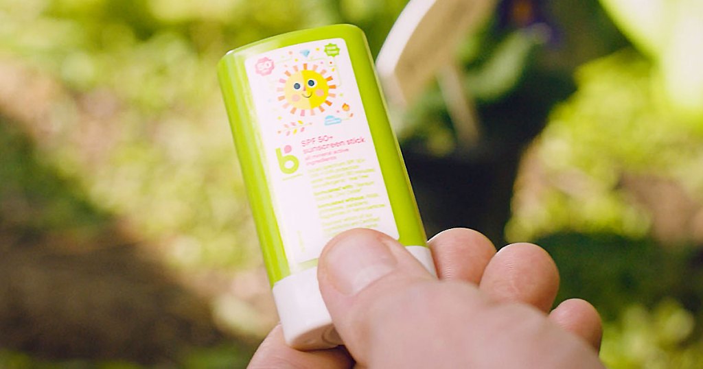 hand holding babyganics sunscreen stick