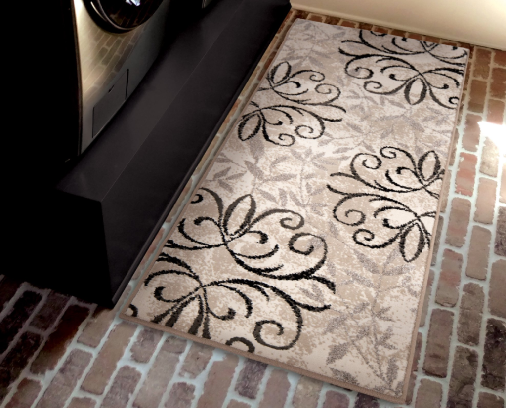 rug in front of a washer and dryer