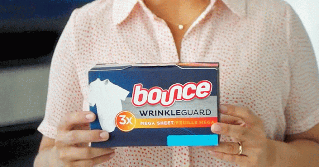 woman holding box of bounce wrinkle guard dryer sheets