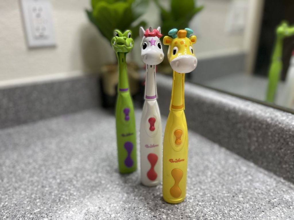 three kids toothbrushes
