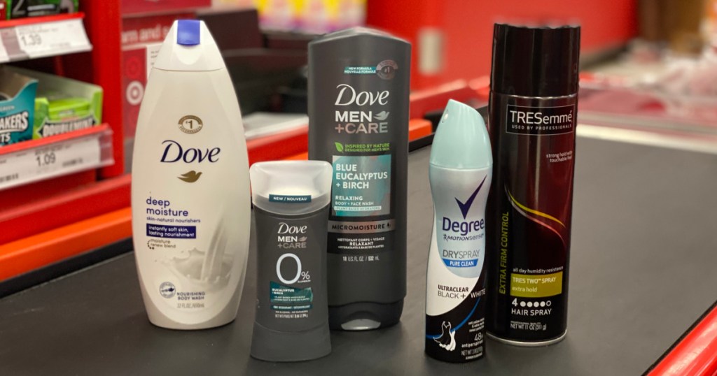 body wash, deodorant and hair spray on conveyor belt 
