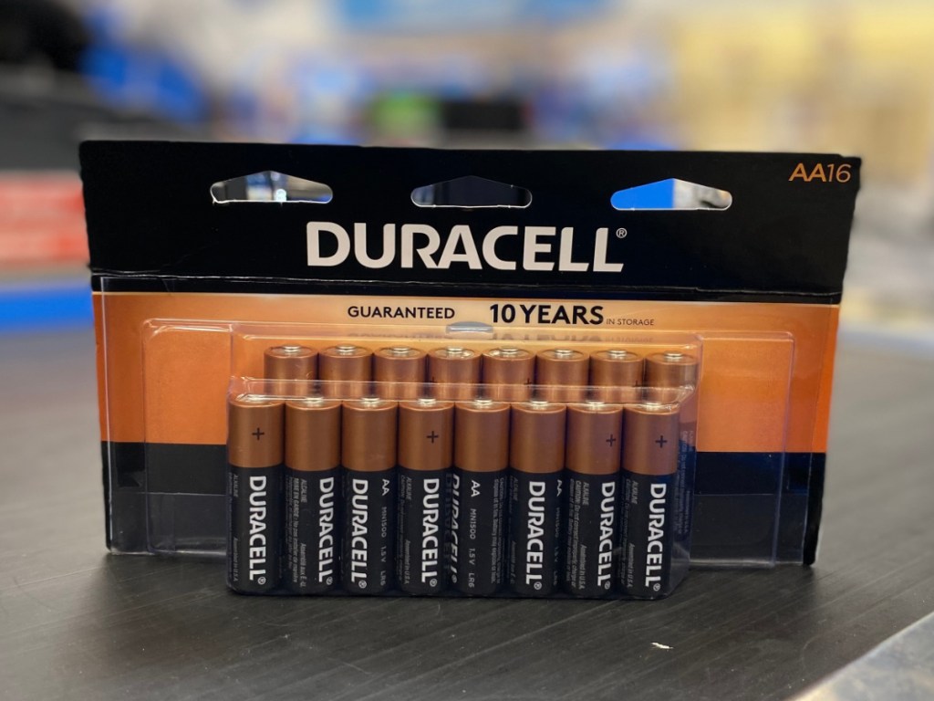 pack of AA batteries on store conveyor belte