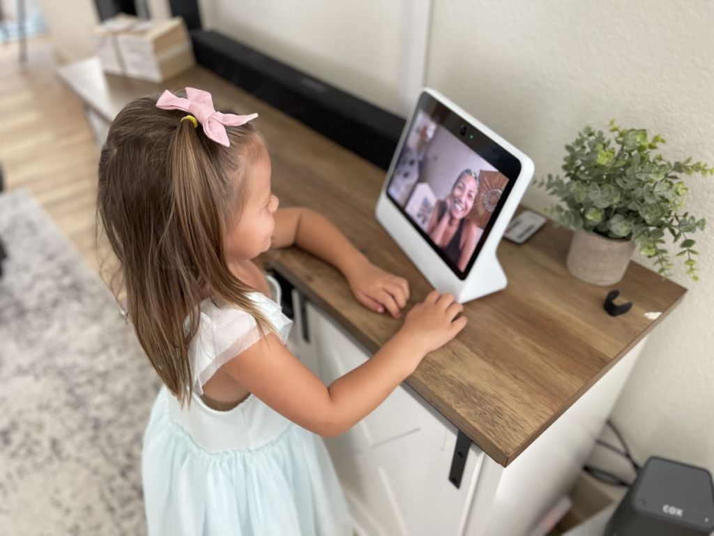 girl looking at a Facebook portal device