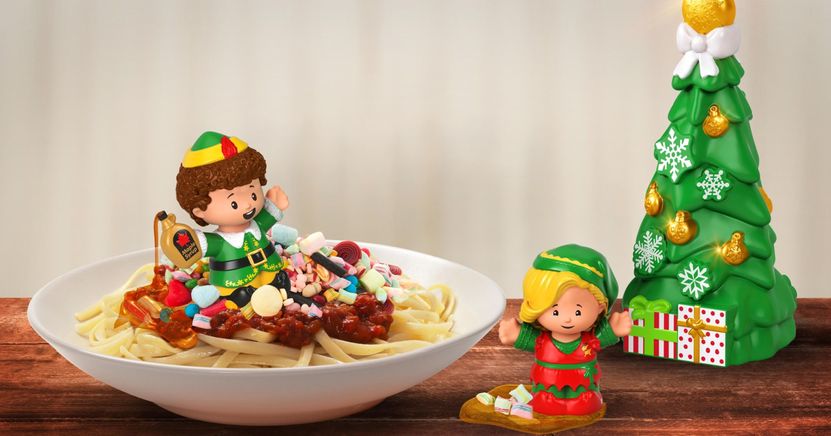 fisher price elf movie figurine set displayed on a bowl of spaghetti