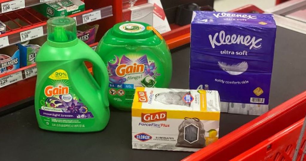 laundry detergent, trash bags and tissues on counter 
