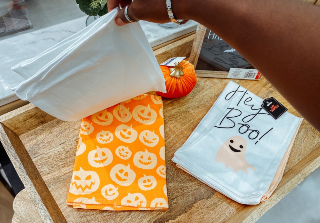 Halloween themed towels on wooden surface