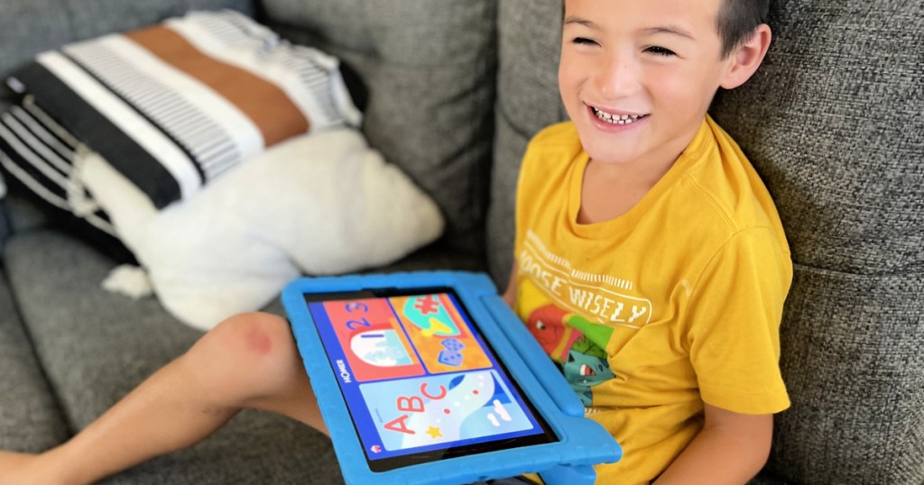 Home early learning program with kid holding tablet