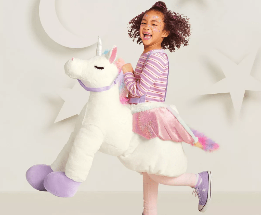 girl wearing a unicorn Halloween costume