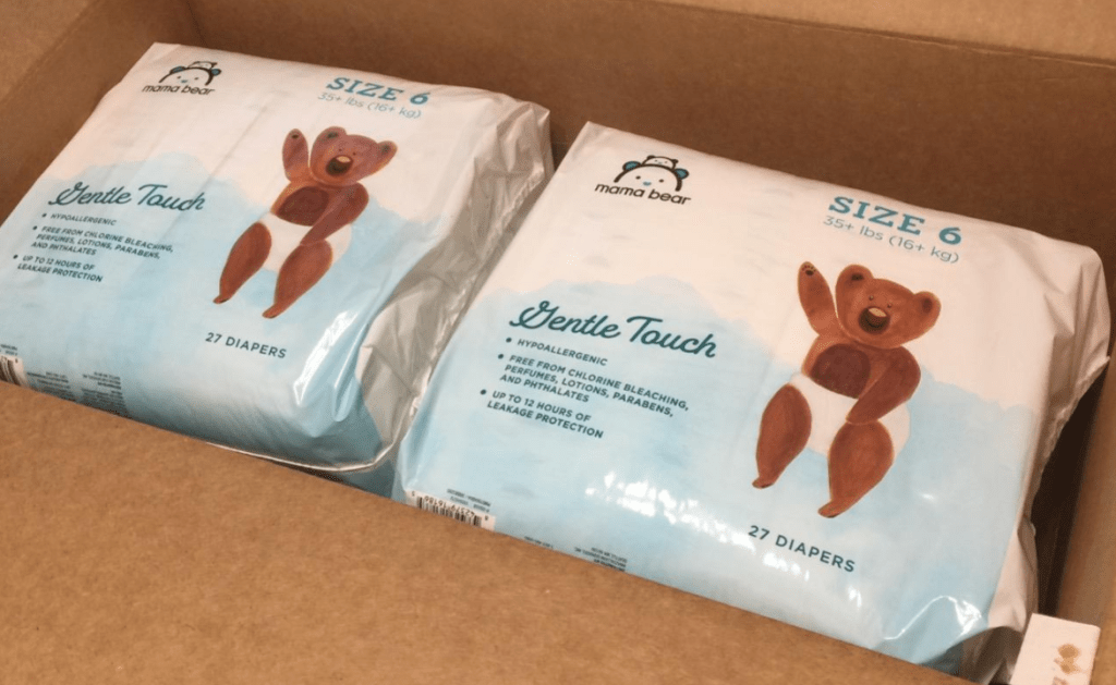 two packs of diapers in a box
