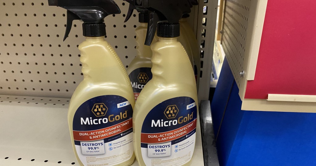 3 bottles of microgold spray on shelf in store