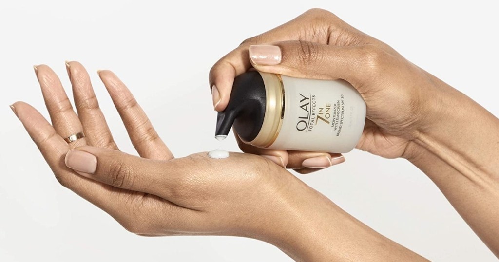 Olay 7-in-1 moisturizer being put on hand