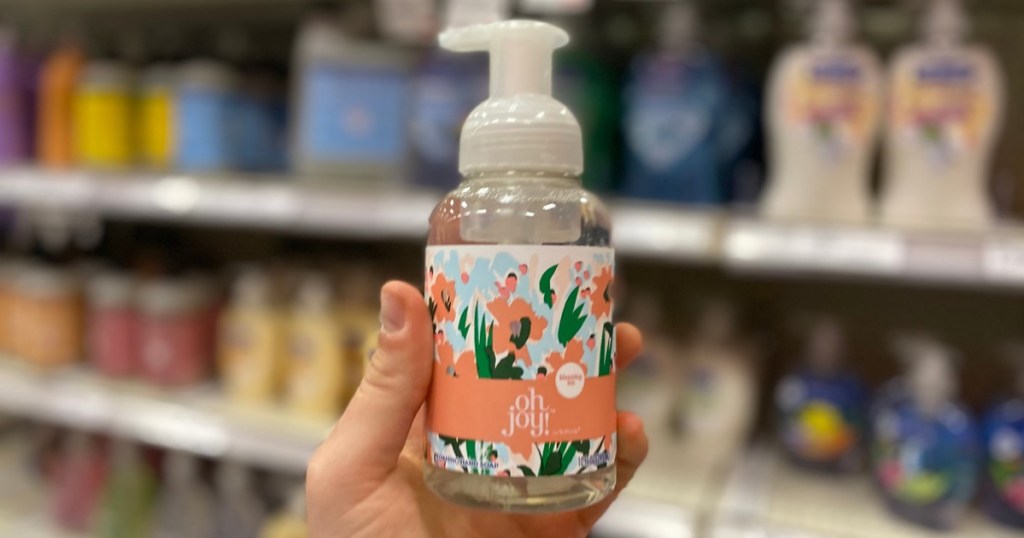 hand holding up Oh Joy Softsoap at Target