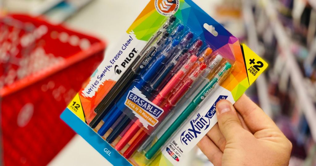 hand holding pack of colorful pens 