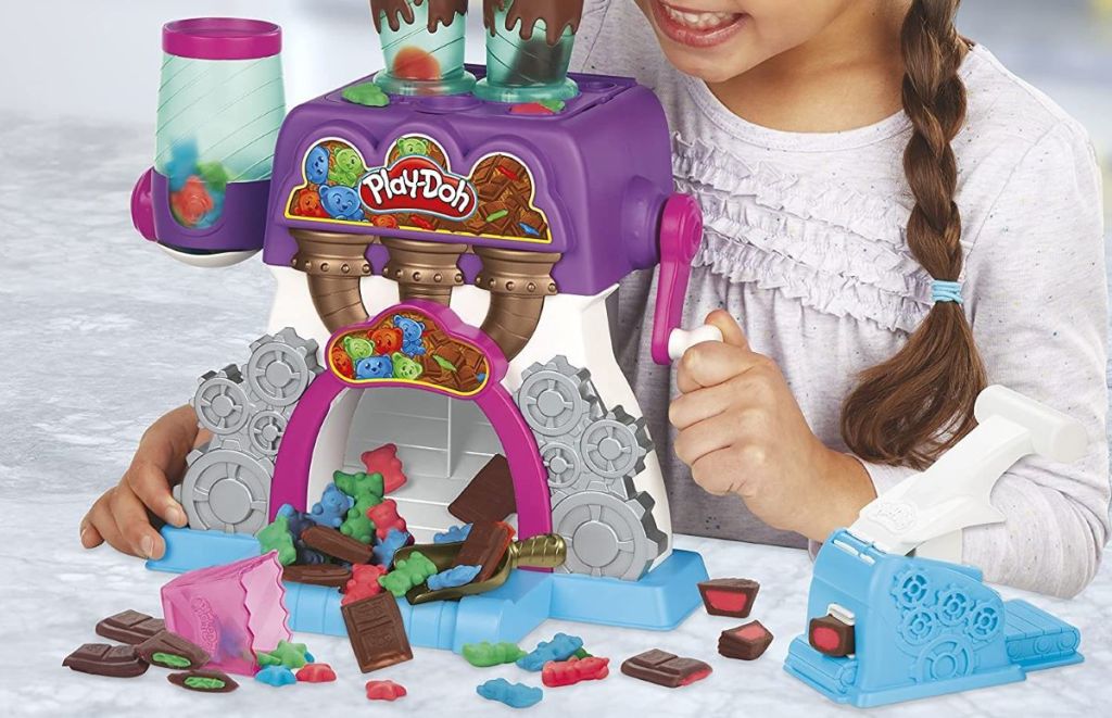 girl playing with a Play-Doh Kitchen Creations Candy Delight