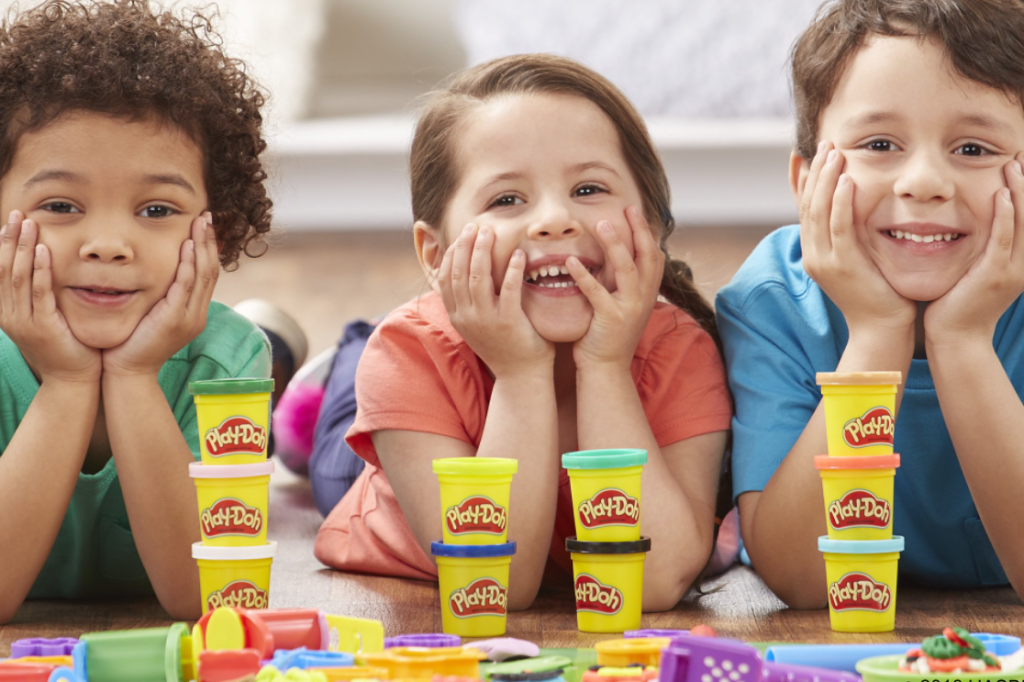 kids sitting with Play-Doh