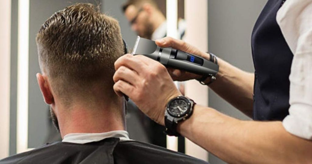 man cutting another mans hair