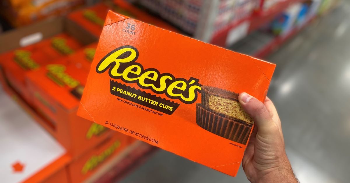 hand holding a box of Reese's Peanut Butter Cups Candy atSam's Club