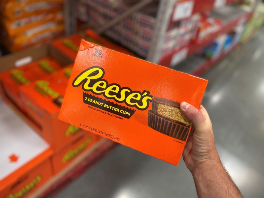 hand holding a box of Reese's Peanut Butter Cups Candy atSam's Club