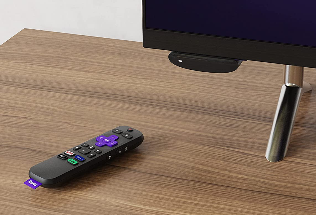 Roku Express 4K remote and device on a tv