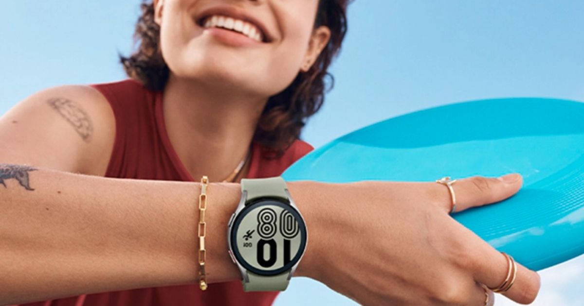 woman holding a frisbee and wearing a samsung galaxy watch