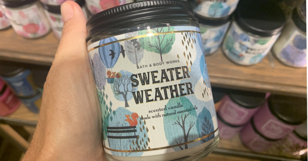Hand holding a Sweater Weather Candle from Bath & Body Works