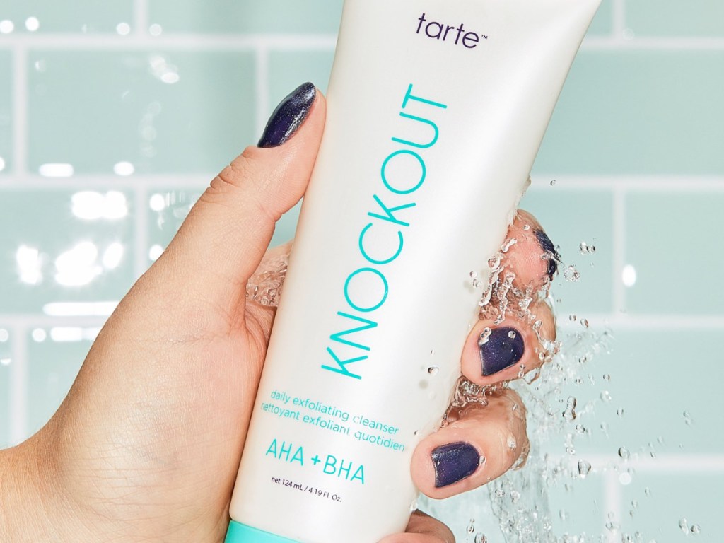 hand holding tarte knockout exfoliating cleanser