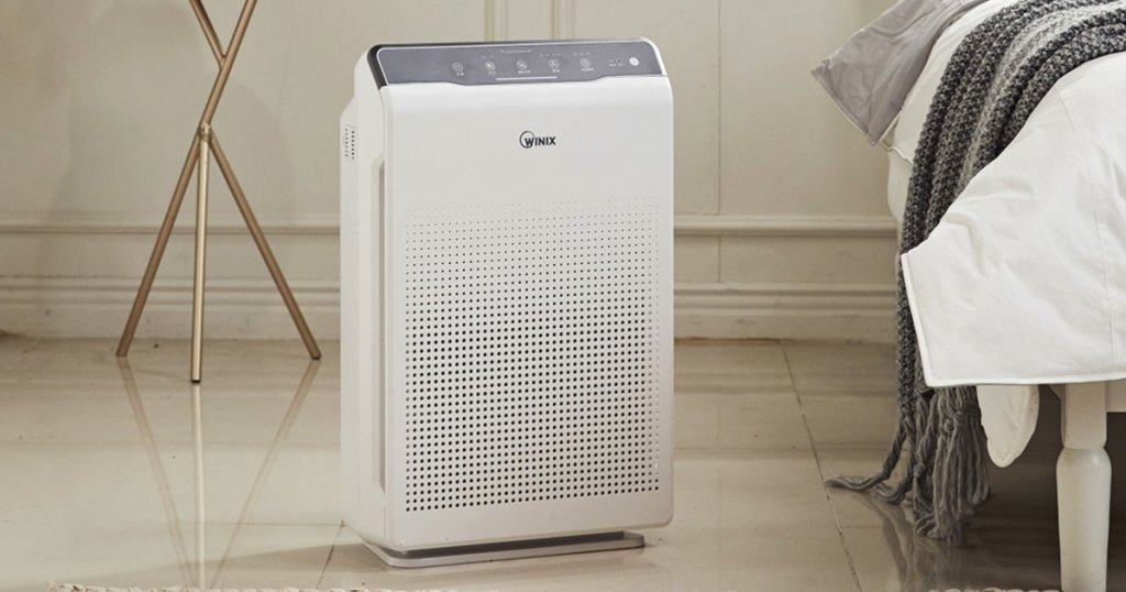 white air purifier in bedroom