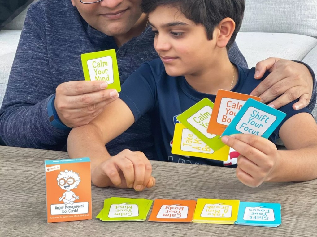 father & son using anger management cards