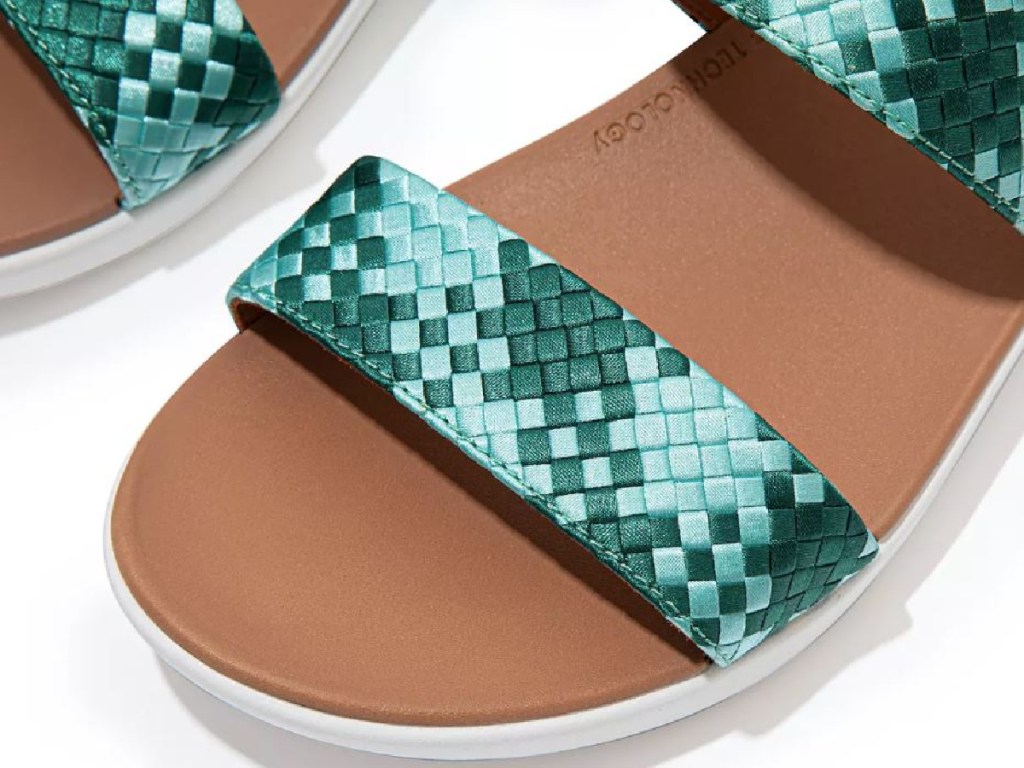 pair of sandals with teal coloring