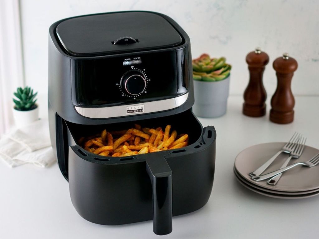 bella black matte air fryer with basket filled with fries