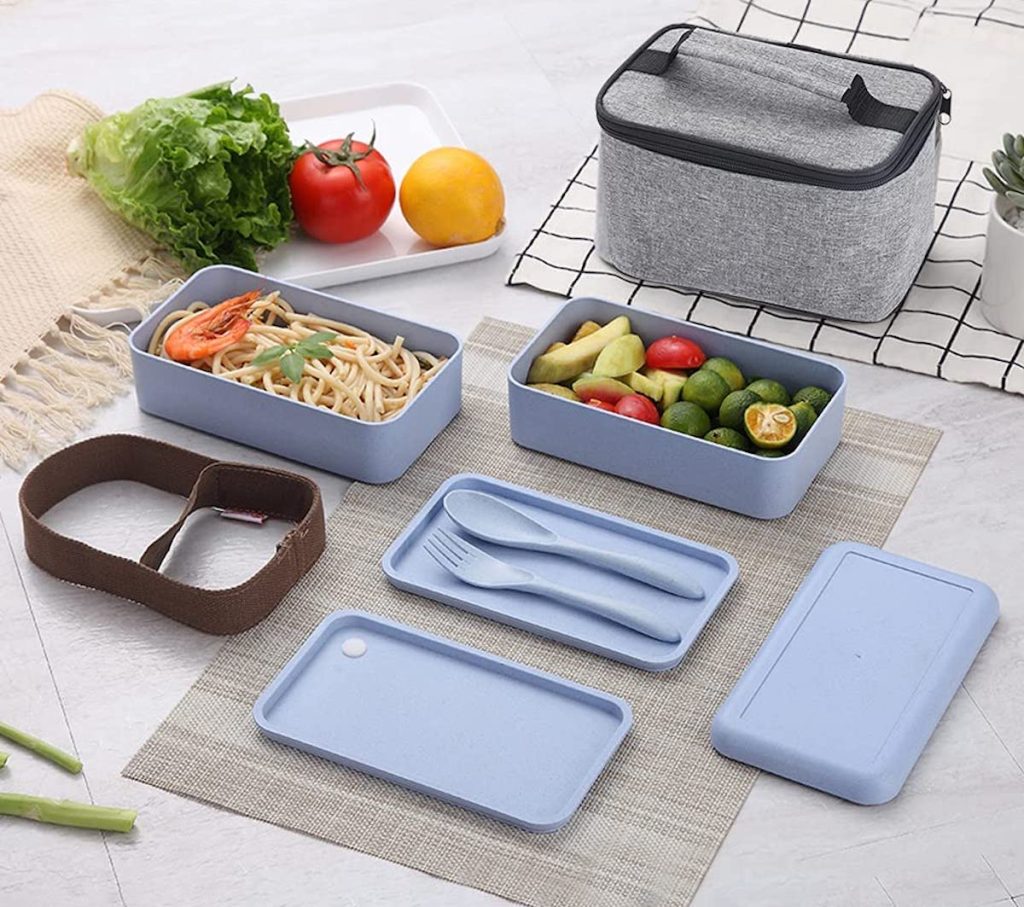 bento box with bag and food spread out on kitchen countertop