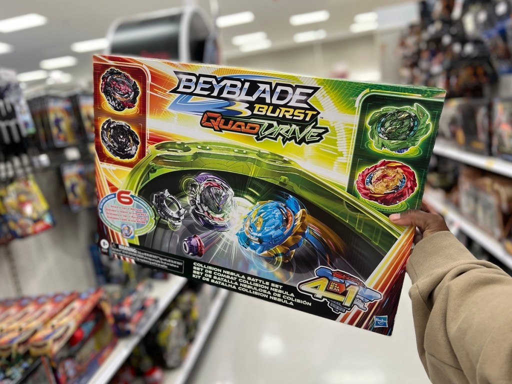 holding a Beyblade stadium in the box