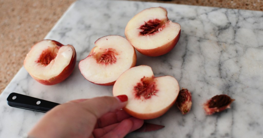 cutting peaches in half