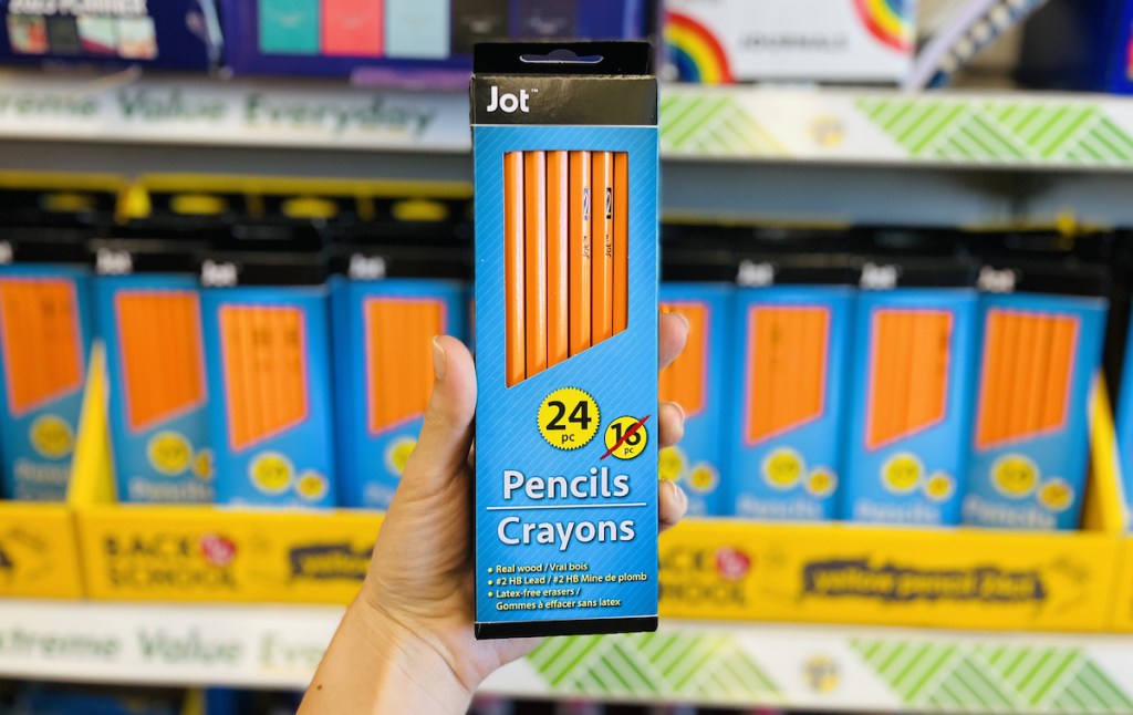 hand holding a pack of joy pencils in dollar tree store