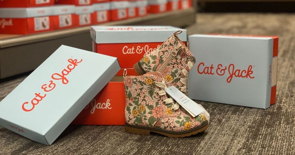 kids floral combat boots in front of Cat & Jack boxes