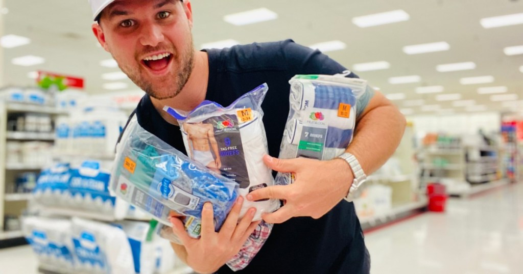 man holding packages of underwear