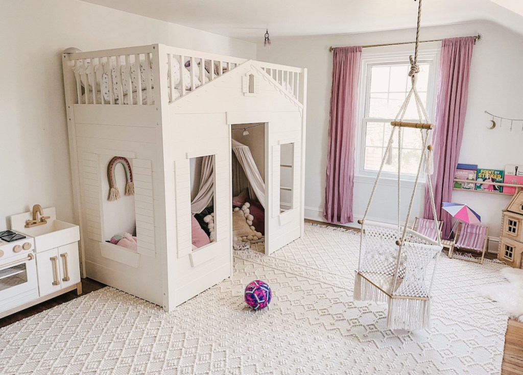 kids bedroom with loft bed and swing