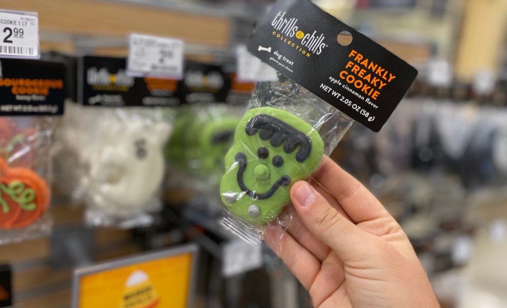 halloween dog cookies in hand at store