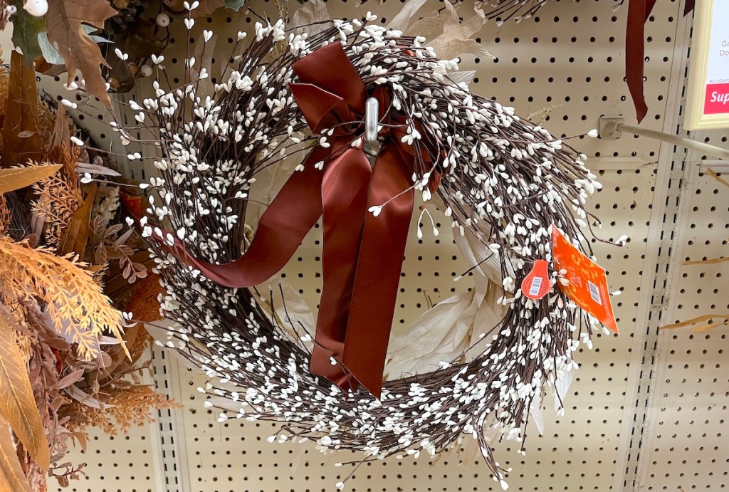 fall wreath hanging on store shelf