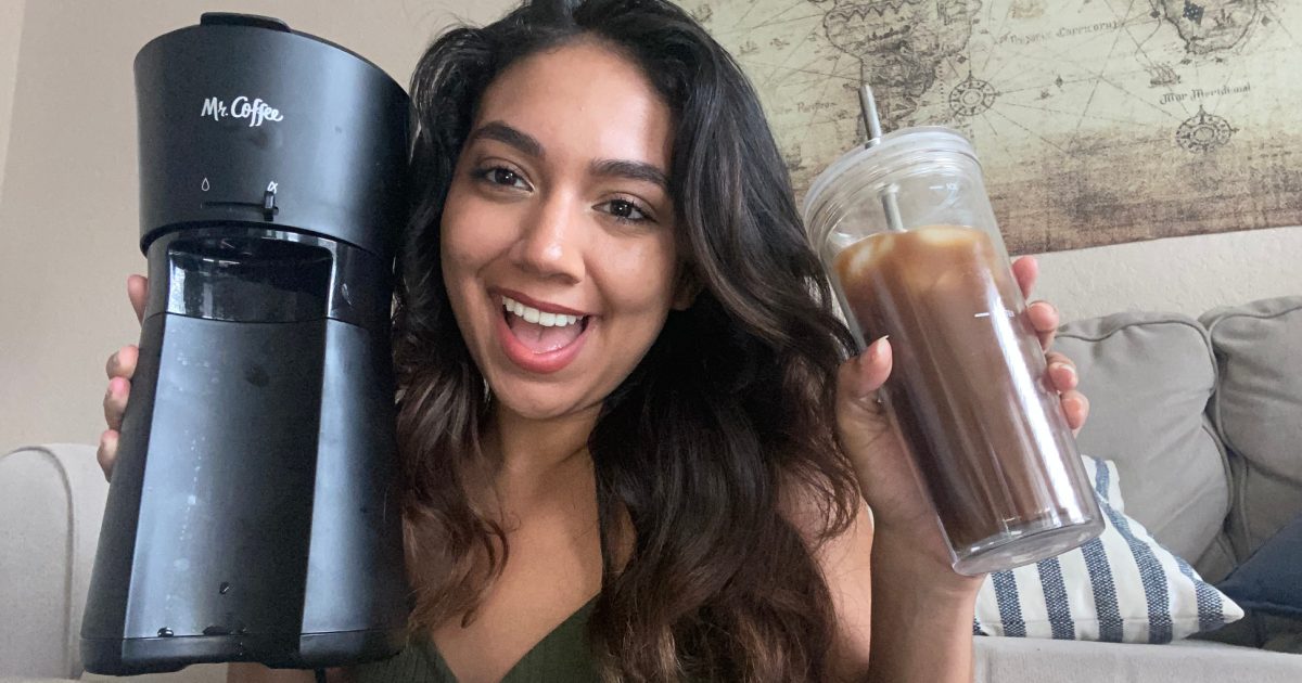 woman with iced coffee maker and tumbler