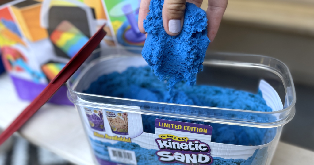 holding Kinetic Sand 