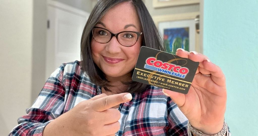 woman holding a Costco Executive Membership