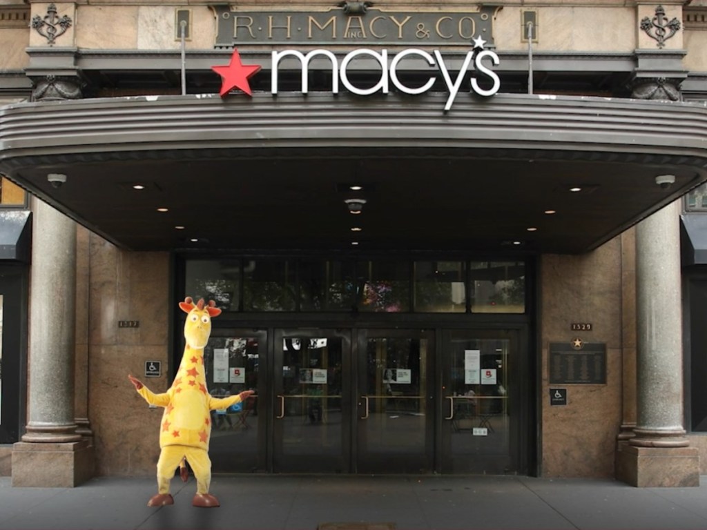 giraffe mascot standing outside Macy's